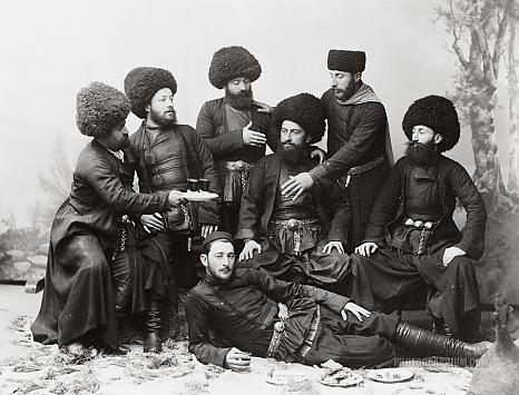 seven_men_in_cossak_costume_posing_as_if_at_a_feast._georgia_republic._1888-1900.jpg